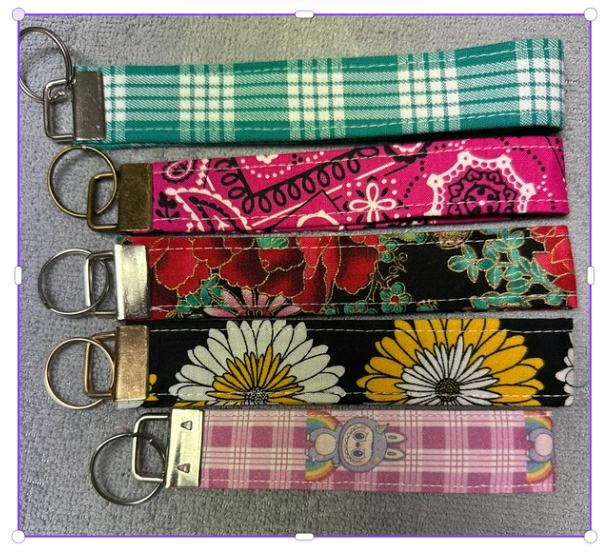 Five patterned fabric wristlet keychains with metal key rings