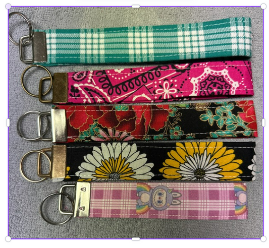 Five patterned fabric wristlet keychains with metal key rings